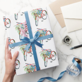 Rode fiets met een ventilatormandje cadeaupapier
