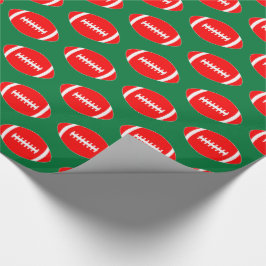 Rode Footballs op de groene achtergrond met kerstc Cadeaupapier