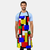Rode, gele, zwarte, blauwe en groene blokken schort (Gedragen)