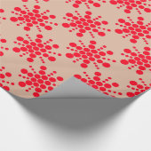 Rode gestippelde ster op taupe cadeaupapier (Hoek)