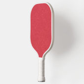 Rode gestructureerd oppervlak met subtiel draaiend pickleball paddle (Links)