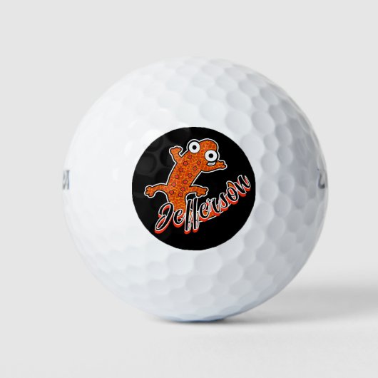 Rode gevlekte salamander op zwarte gepersonaliseer golfballen (Voorkant)