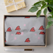 Rode harten op grijs tissuepapier (Geschenk)
