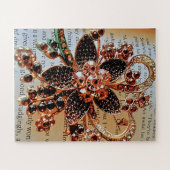 Rode juwelen broche op gedrukte achtergrond legpuzzel (Horizontaal)
