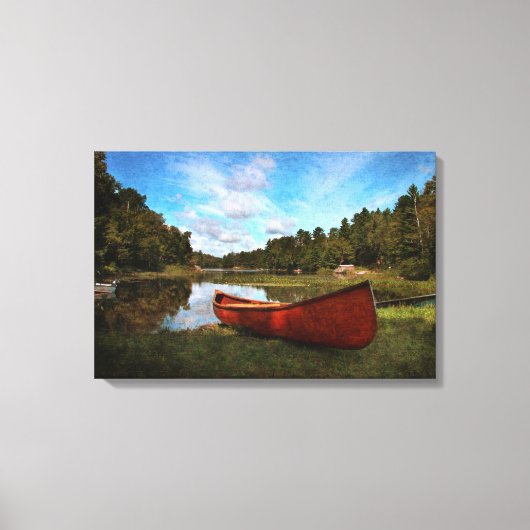 Rode kano op de oever van het meer canvas afdruk (Voorkant)