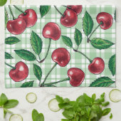 Rode kersen op lichtgroene gingham theedoek (Gevouwen)