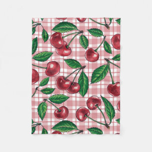 Rode kersen op roze gingham fleece deken