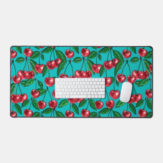 Rode kersen op turquoise bureaumat (Keyboard & Muis)