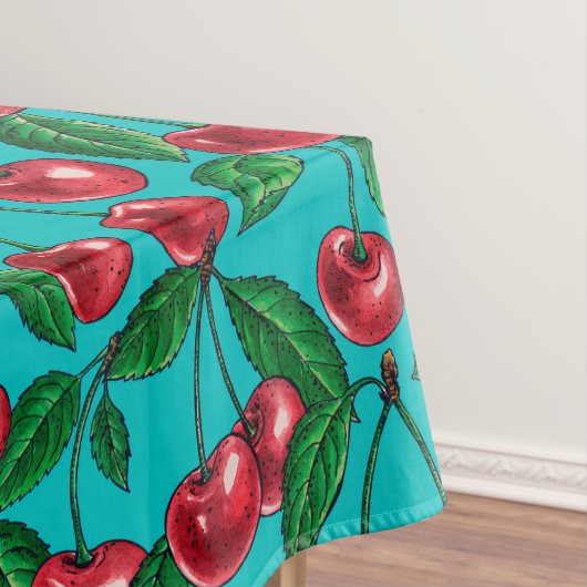 Rode kersen op turquoise tafelkleed (Voorbeeld)