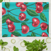Rode kersen op turquoise theedoek (Gevouwen)