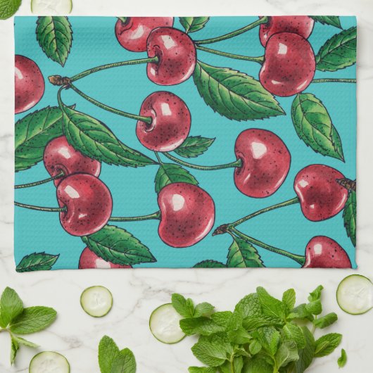 Rode kersen op turquoise theedoek (Gevouwen)