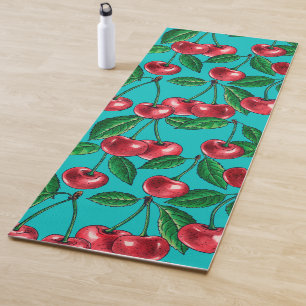 Rode kersen op turquoise yogamat