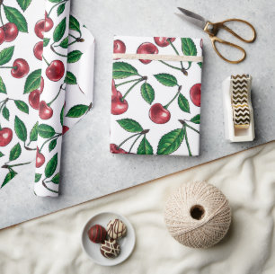 Rode kersen op wit cadeaupapier