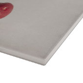 Rode kersenvruchten witte kom in gedempte tonen fo snijplank (Hoek)