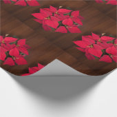 Rode kerstbloem op bruin cadeaupapier (Hoek)