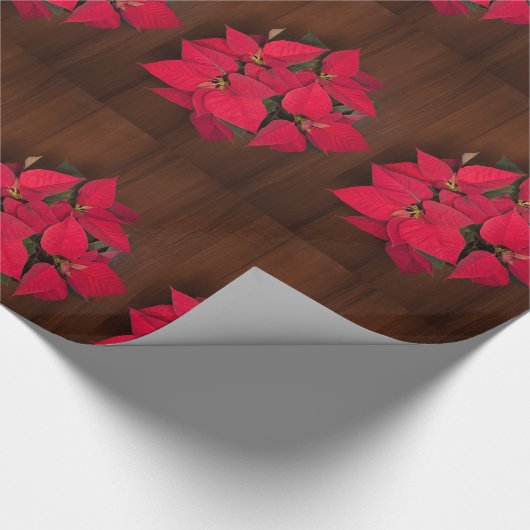 Rode kerstbloem op bruin cadeaupapier (Hoek)