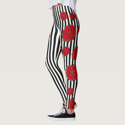 Rode kerstbloem op zwart en wit gestreept leggings (Links)