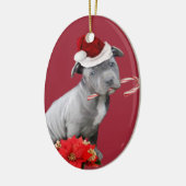 Rode kerstpup-sierbloem keramisch ornament (Links)
