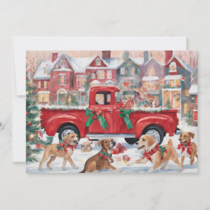 Rode kersttruck in dorp met puppy's feestdagenkaart