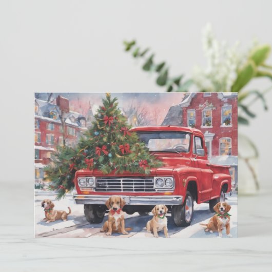 Rode kersttruck in dorp met puppy's feestdagenkaart (Staand voorkant)