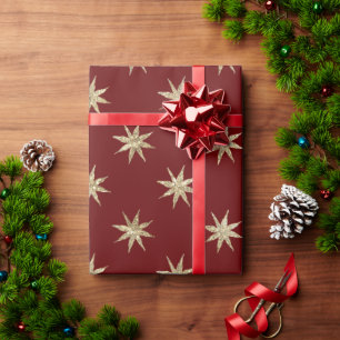 Rode kerstverpakkingsfolie met gouden sterrenpatro cadeaupapier