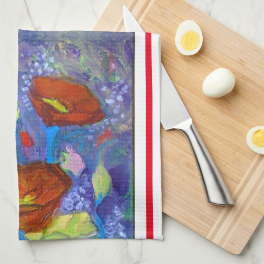 Rode klaprozen op blauwe keukenhanddoek (Quarter Fold)