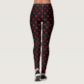 Rode kruisstift op zwarte leggings (Achterkant)
