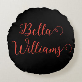 Rode noot op zwart rond kussen