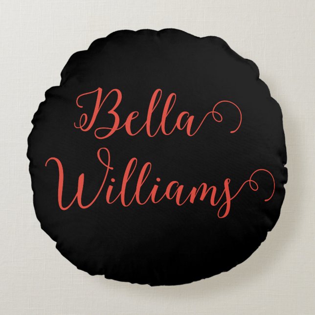 Rode noot op zwart rond kussen (Voorkant)