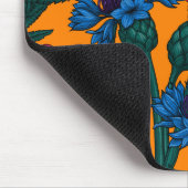 Rode papaver en blauwe cornbloemen op sinaasappel muismat (Hoek)