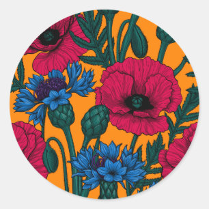 Rode papaver en blauwe cornbloemen op sinaasappel ronde sticker