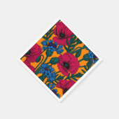 Rode papaver en blauwe cornbloemen op sinaasappel servet (Hoek)