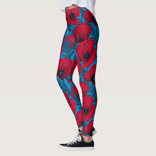 Rode papavertuin op blauw leggings (Links)