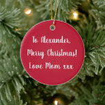 Rode persoonlijke naam Merry Kerstmis van mama Keramisch Ornament<br><div class="desc">Dit is een gepersonaliseerd rood kerstontwerp met de boodschap "Naar Alexander, vrolijk kerstfeest! Love Mam xxx" in stijlvolle witte typografie/script. Op de achterkant staat de boodschap "Kerstmis 2022". Verander eenvoudig de naam Alexander, in de naam van uw geliefde in personaliseer dit tekstvakje. Hier hebt u ook de optie om het...</div>