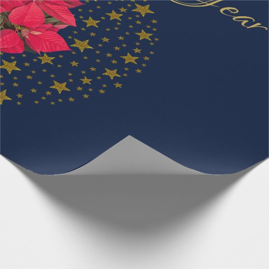 Rode Poinsettia Plant op glinsterende sterrenblauw Cadeaupapier (Hoek)