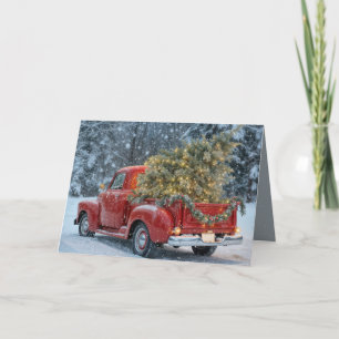 Rode retro truck met kerstboom in sneeuwvlokken kaart