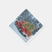 Rode retro truck met kerstboom in sneeuwvlokken servet (Hoek)