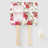 Rode roos en een zwarte, klassieke ventilator voor handwaaier