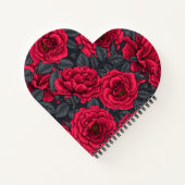 Rode rozen met grijze bladeren op zwart notitieboek (Achterkant)