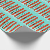 RODE SKI'S MET SNEEUW OP BLAUW INPAKPAPIER (Hoek)