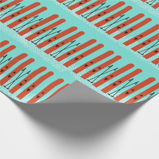 RODE SKI'S MET SNEEUW OP BLAUW INPAKPAPIER (Hoek)