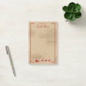 Rode slee van kerstman op nep oude versleten papie post-it® notes (Kantoor)