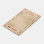 Rode slee van kerstman op nep oude versleten papie post-it® notes (Schuin)