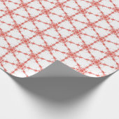 Rode sneeuwvlokken op wit cadeaupapier (Hoek)