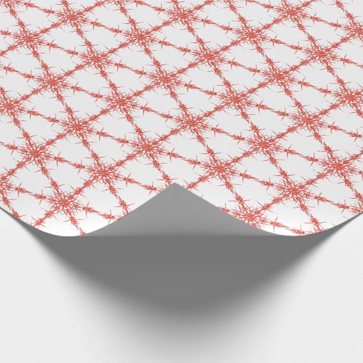 Rode sneeuwvlokken op wit cadeaupapier (Hoek)