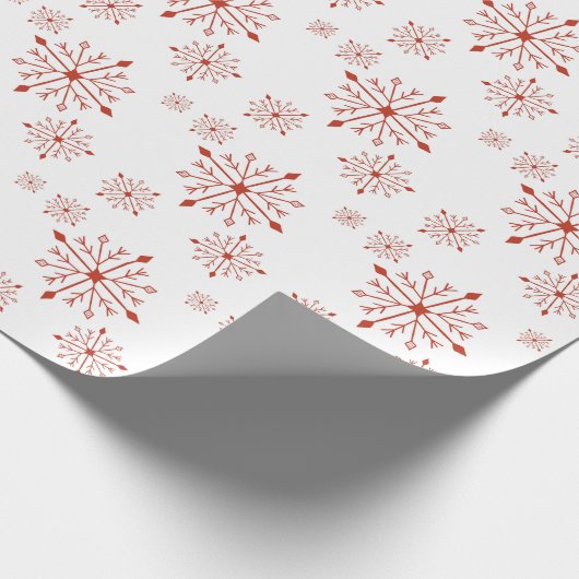Rode sneeuwvlokken op wit inpakpapier (Hoek)