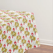 Rode snoepjes goudlinten op witte kerst tafelkleed (Voorbeeld)