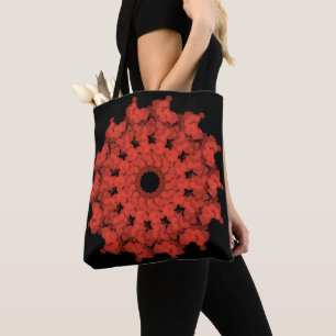 Rode ster explosie aan zwarte hemel tote bag