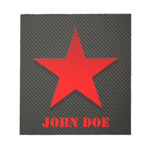 Rode ster op zwarte koolstofvezel notitieblok