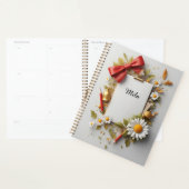 Rode strik, gouden bel en decoratieve elementen planner (Display)